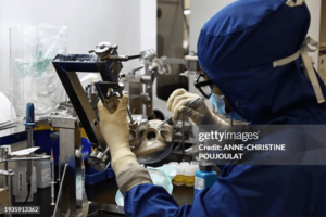 An employee at a medical technology company works on an artificial heart.