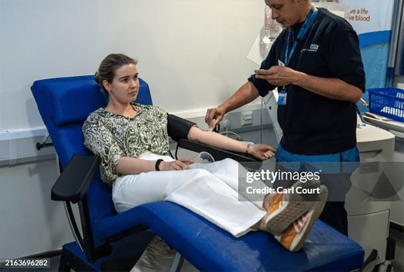 A nurse prepares to draw blood from a woman for a blood donation. A new study has identified a blood test that could effectively identify the presence of hundreds of diseases using only the proteins in one drop of blood.