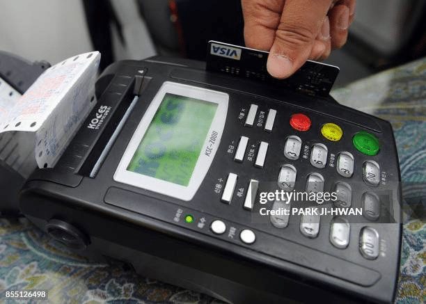 Scanning a credit card with a magnetic stripe.