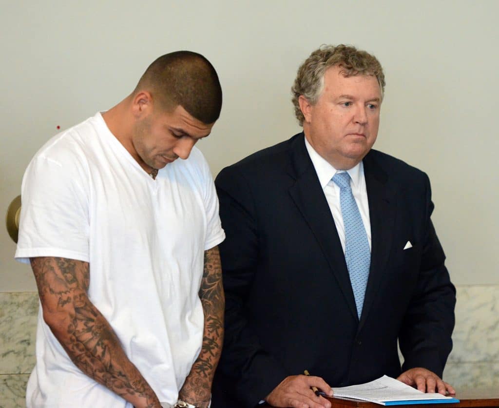 Aaron Hernandez charged with murder and gun violations