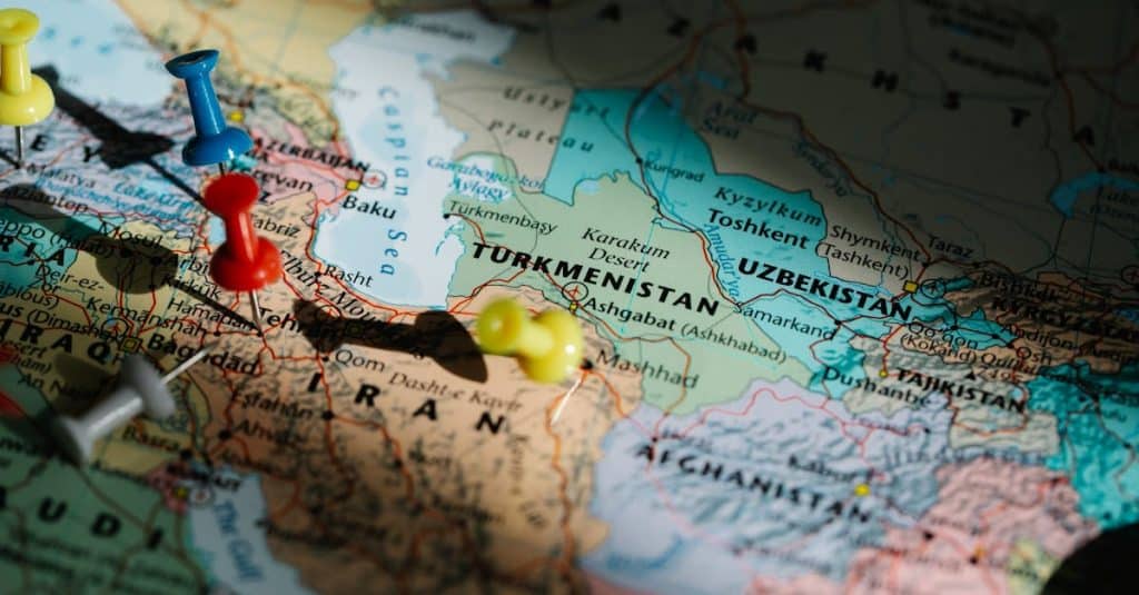 Colorful pushpins marking locations on a detailed map of Central Asia.