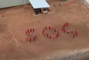 Migrants at Texas detention center form S.O.S.