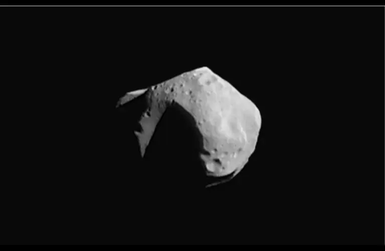 Image of Asteroid Mathilde 1997. The whitish/grayish issue sits on the darkness of space.