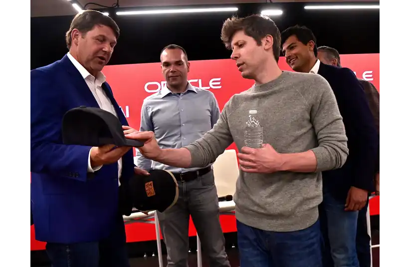 OpenAI CEO Sam Altman admires the leather patch on a West Texas-themed ball cap presented to him by U.S. Rep. Jodey Arrington, R-Lubbock, Tuesday Sept. 23, 2025. Altman and others hosted a tour of the Stargate data center under construction in north Abilene