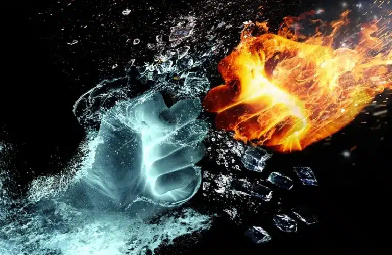 Two fists of opposing elements to symbolize conflict along the Strait of Hormuz amid missile and drone strikes along the waterway.
