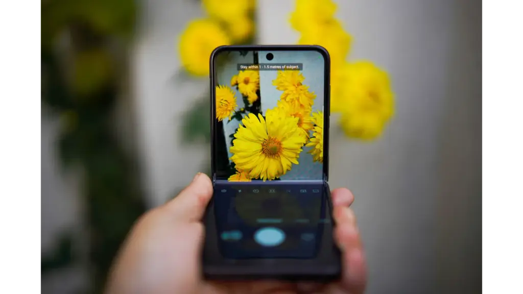 a smartphone capturing vivid yellow flowers blends technology and nature beautifully, much like how foldable phones merge innovation with everyday life.