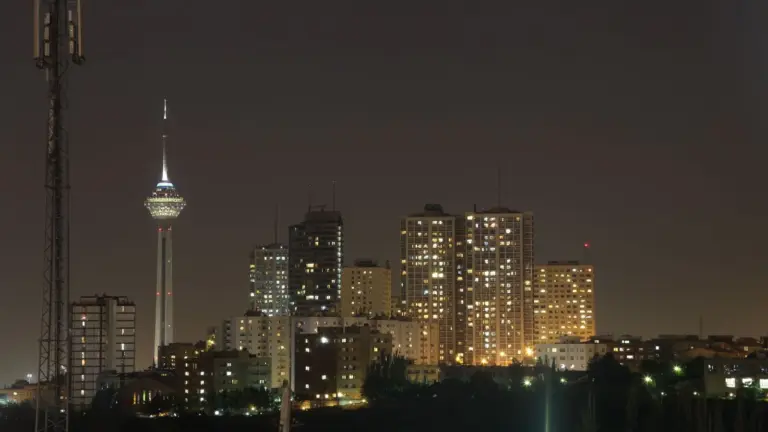 Picturesque view of Tehran, Tehran Province, Iran at night overlooking the skyline with iconic Milad Tower prominently in view