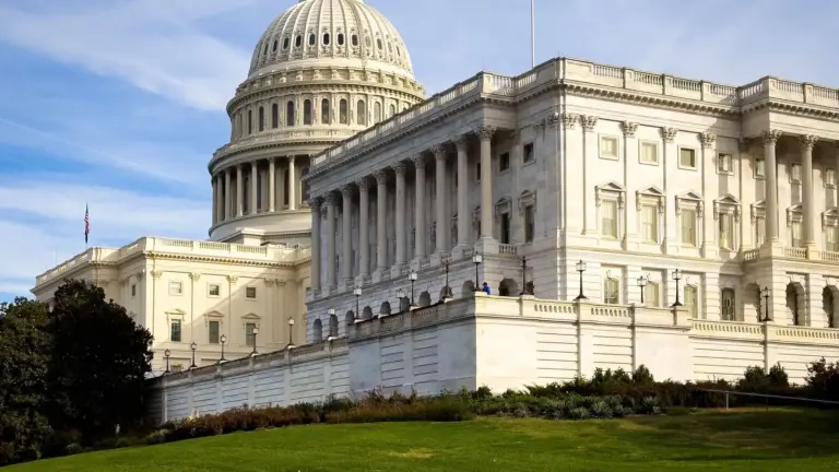 A picturesque view of the United States Capitol Building in Washington, DC, under a clear sky.